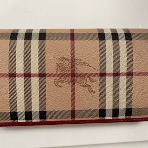 Beautiful Burberry wallet. Used one time. Have the bag, dust bag, and the tag.